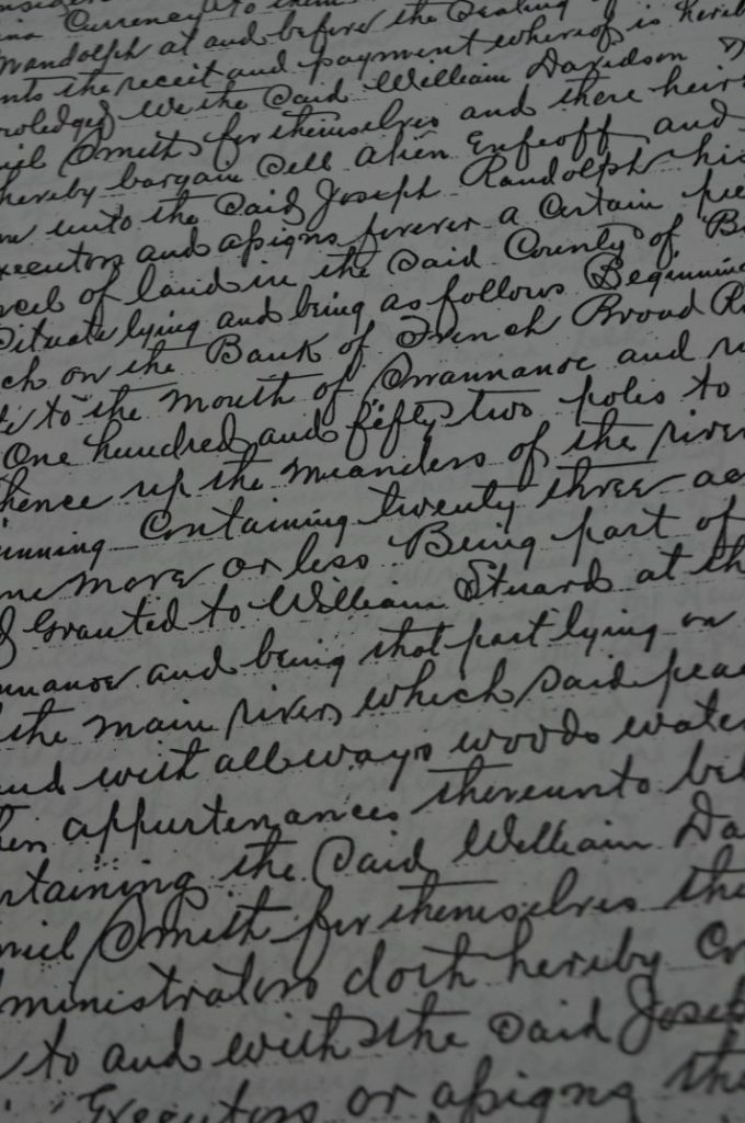 Close-up of a photocopy of some handwriting on a late 18th-century property deed.