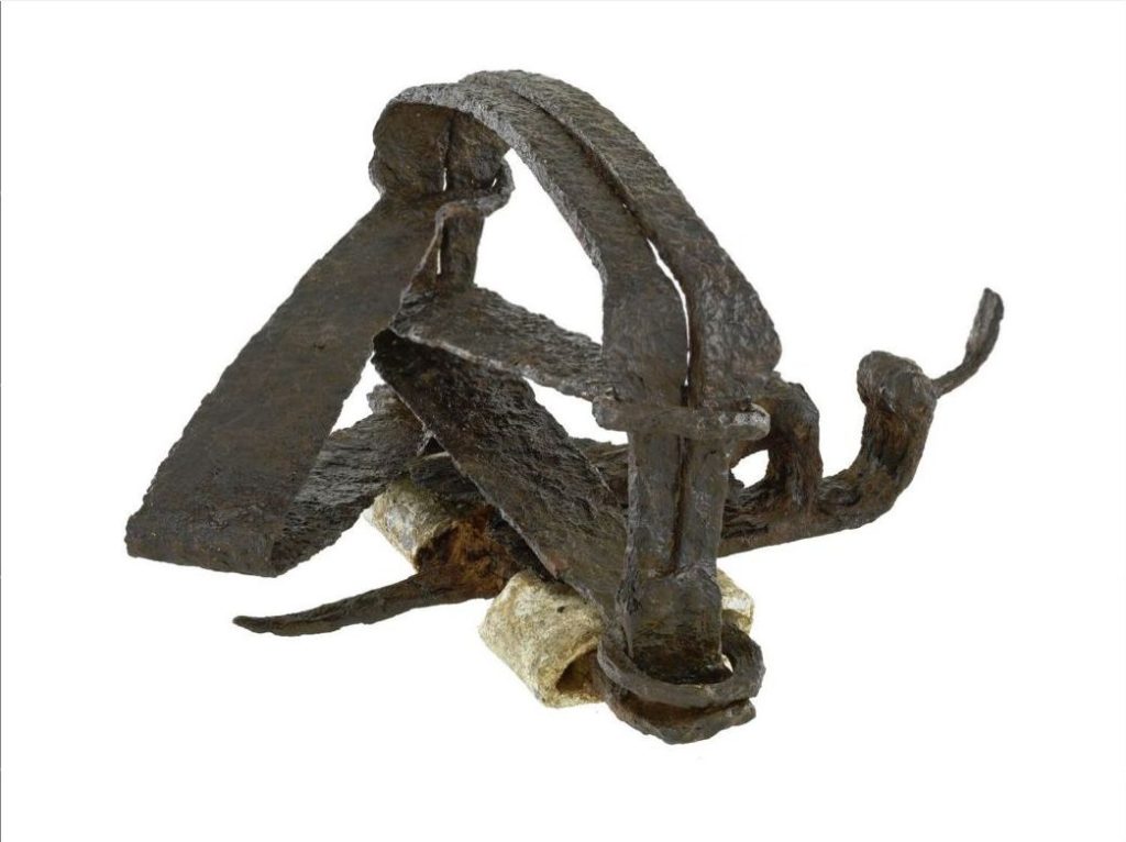 Rusty metal beaver trap.