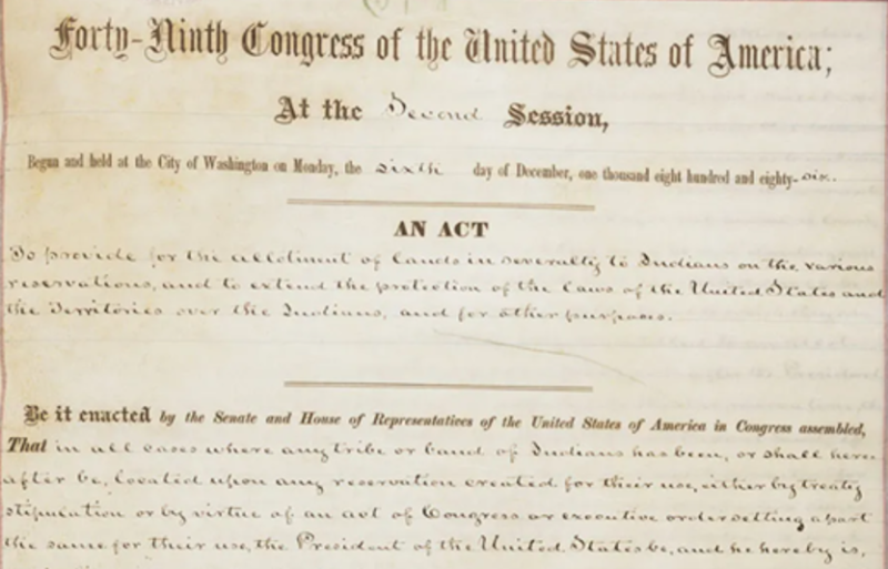 Cropped version of a scan of the first page of the Dawes Act on yellowed paper in brown ink. Transcript: "Forty-Ninth Congress of the United States of America; At the Second Session, Begun and held at the City of Washington on Monday, the sixth day of December, one thousand eight hundred and eight-six. An Act to provide for the allotment of lands in severalty to Indians on the various reservations, and to extend the protection of the laws of the United States and the Territories over the Indians, and for other purposes. Be it enacted by the Senate and House of Representatives of the United States of America in Congress assembled, That in all cases where any tribe or band of Indians has been, or shall hereafter be, located upon any reservation created for their use, either by treaty stipulation or by virtue of an act of Congress or executive order setting apart the same for their use, the President of the United States be, and he hereby is," The rest of the page is included in the blog post. See the caption of that image for a link to the rest of the document and the full transcript.