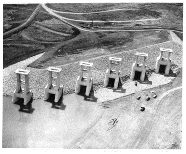 Black-and-white aerial photo of six intake structures.