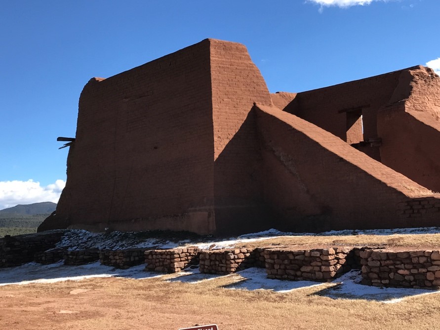 Red brick building in the desert.