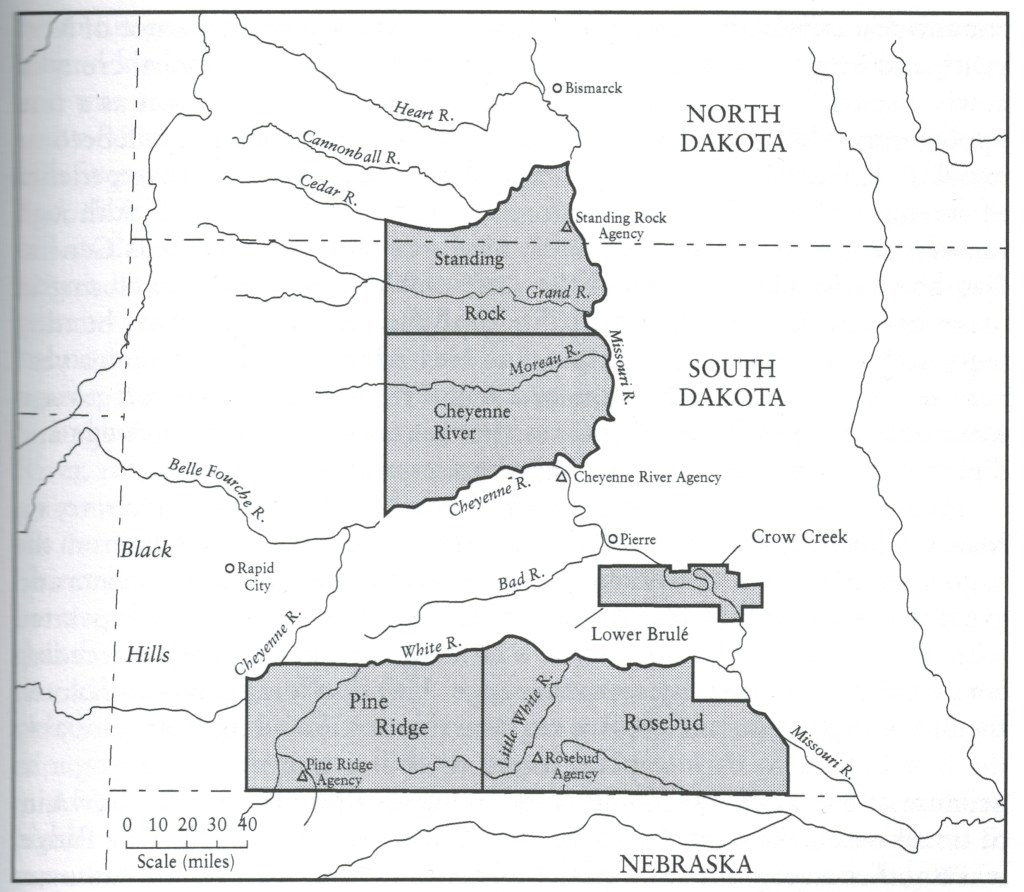 Black-and-white map of South Dakota and parts of all surrounding states, showing the location of Standing Rock, which straddles the boundary with North Dakota in the center, Cheyenne River, which is located just to the south of Standing Rock and reaches approximately down to the very middle of the state, Crow Creek, which occupies a smaller area on the Missouri around the Big Bend, and Pine Ridge and Rosebud which both border on the Nebraska state line in the southern part of the state, Rosebud to the east, bordering on the Missouri, Pine Ridge to the west.