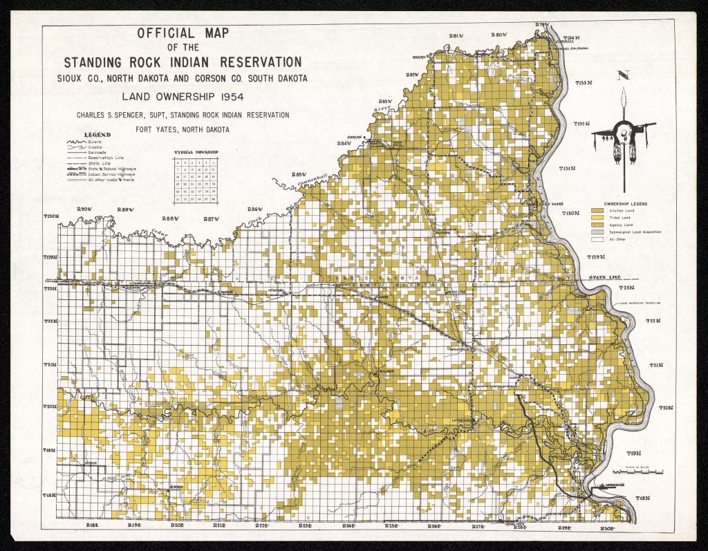 Map of Standing Rock Reservation, divided into small squares. Some are blank, others are colored in in various shades of yellow to denote ownership.